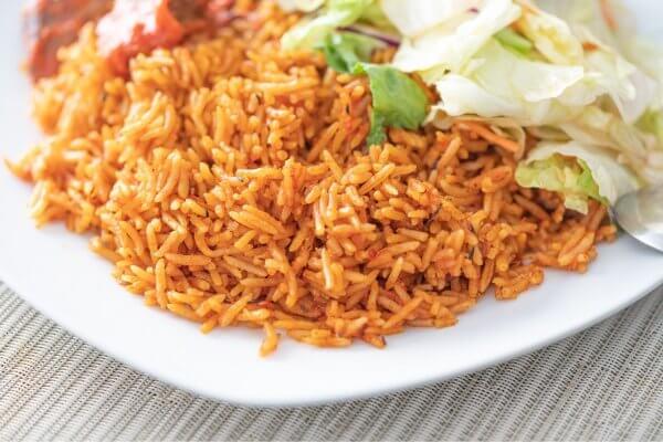 Nigerian jollof rice served with salad is a healthy source of carbohydrates