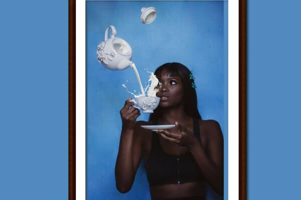 How PCOS is affeted by ilk and other dairy - dark skinned lady drinking from a teacup of ilk - tea pot spilling milk over her head.