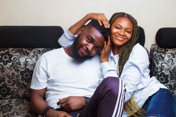 birth control side effects - lady and man of african background smiling playfully to the camera