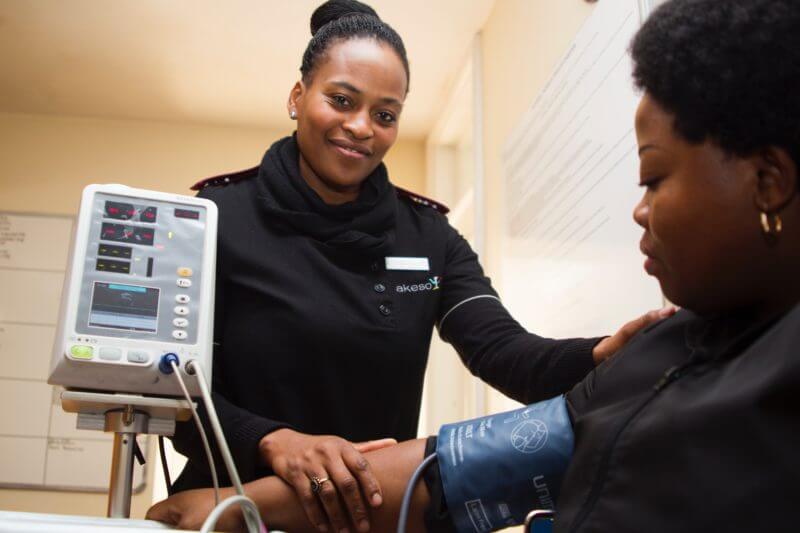 essential lifestyle changes in treating hypertension - lady having her blood pressure checked