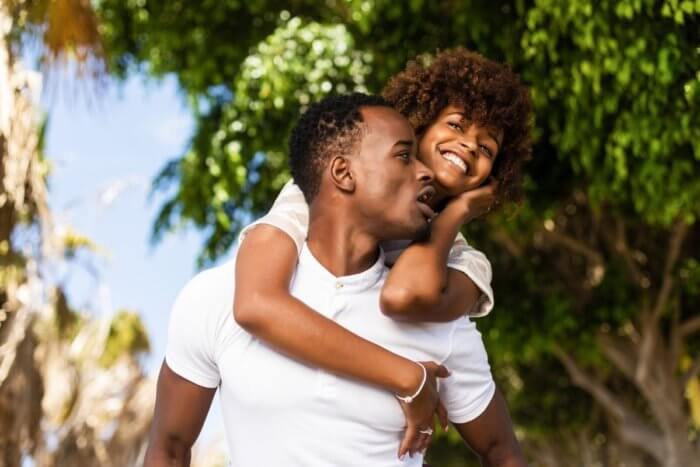 Image of young black couple hugging for post on local contraceptives in Nigeria